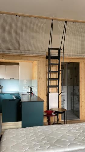 a kitchen with a ladder in the middle of a room at Seehaus Familie Leifer in St. Wolfgang