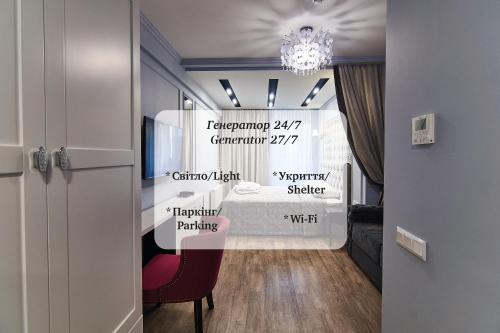 a room with a bed and a chandelier at Light Hotel in Dnipro