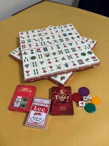 a table with a japanese board game on it at Comfortable Retreat in Megah Ria in Masai