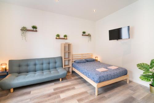Ένα ή περισσότερα κρεβάτια σε δωμάτιο στο Cozy Antwerp City Apartments