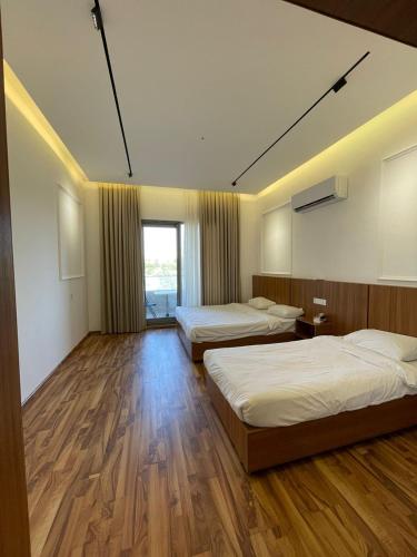 Krevet ili kreveti u jedinici u objektu Hotel Dawa