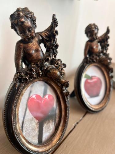 a small statue of a little cherub in a mirror at L'Ancienne ferme in Eus