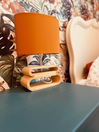 a lamp sitting on top of a table at L'Ancienne ferme in Eus