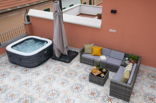 an aerial view of a balcony with a hot tub at Attico Belvedere - Terrazza Vista Mare con Barbecue e Jacuzzi Privata in Ceriale