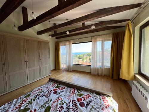 a bedroom with a bed and a large window at Villa Alessandra in Emona