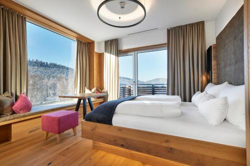 Postel nebo postele na pokoji v ubytování Resort Hotel Bodenmais