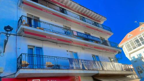 a building with balconies on the side of it at Hotel Arganda in Arganda del Rey