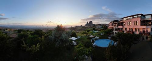 an aerial view of a resort with a swimming pool at Karlık Evi Hotel - Special Category in Uchisar