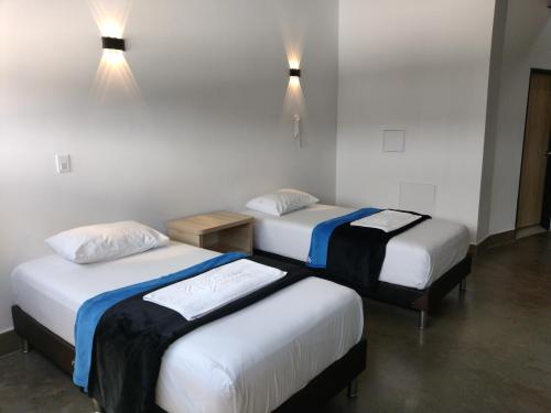 Postel nebo postele na pokoji v ubytování Hotel El Cordobes