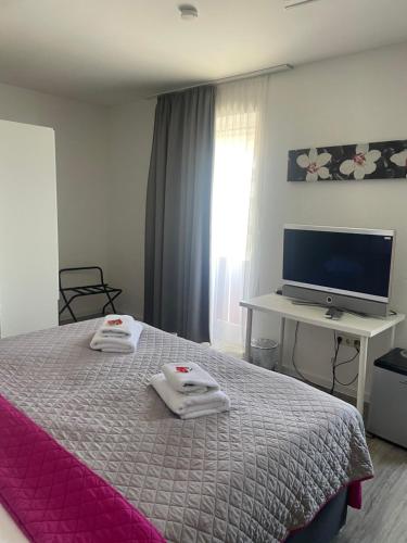 Postel nebo postele na pokoji v ubytování Hotel Corsten