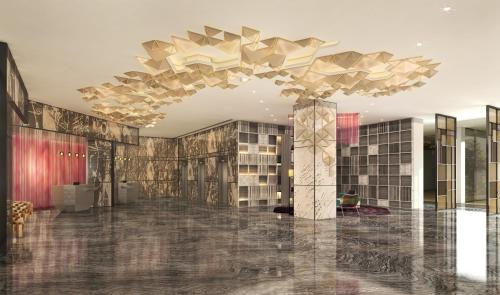 a rendering of a lobby with a chandelier at Renaissance Ahmedabad Hotel in Ahmedabad