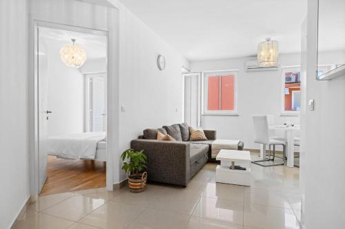 Charming White Apartment with Balcony and Parking