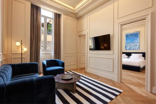 a living room with a couch and a bed at The First Arte - Preferred Hotels & Resorts in Rome