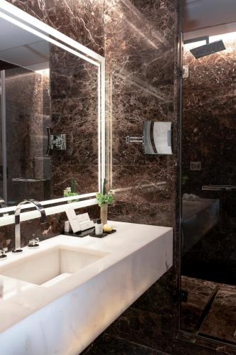 a bathroom with a sink and a shower at The First Arte - Preferred Hotels & Resorts in Rome