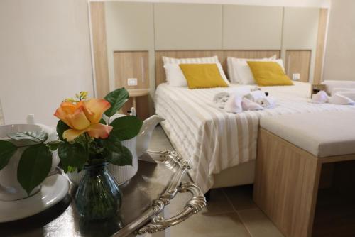 a bedroom with a bed with stuffed animals on it at Locanda la Rocca Residenza d'Epoca in Fossombrone