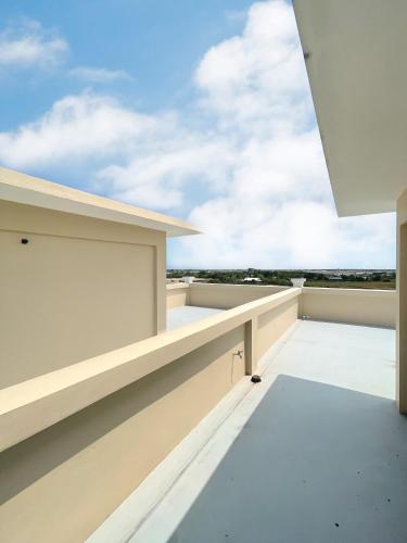 an empty balcony with a view of the sky at Suksiri Banlaem in Ban Laem