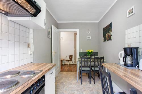 a kitchen and dining room with a table and chairs at Ferienwohnungen Roth in Willingen