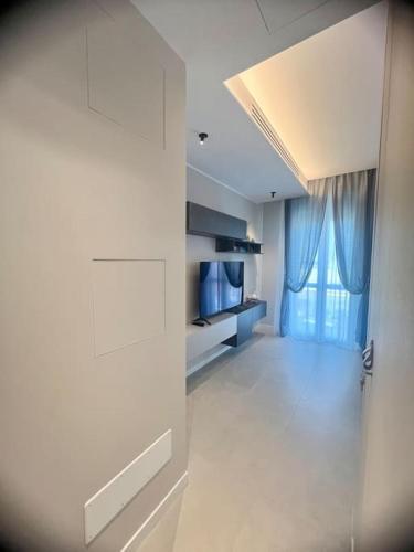 a white room with a door and a window at Il Nido Guest House in Piacenza