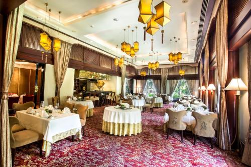 a dining room with tables and chairs at Taj Krishna in Hyderabad