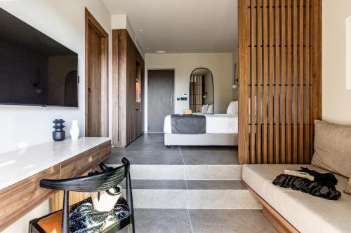 a living room with a bed and a couch at Elios Hill in Hersonissos