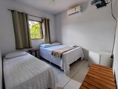 Postel nebo postele na pokoji v ubytování Pousada Bougainville