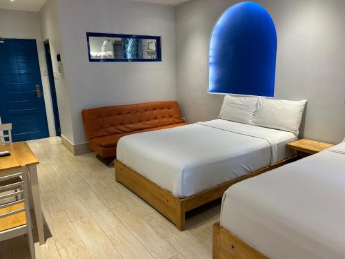 Postel nebo postele na pokoji v ubytování Oktowaves hotel
