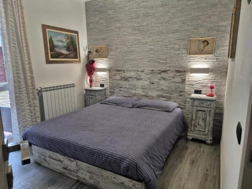 Un pat sau paturi într-o cameră la La Dolce Corte
