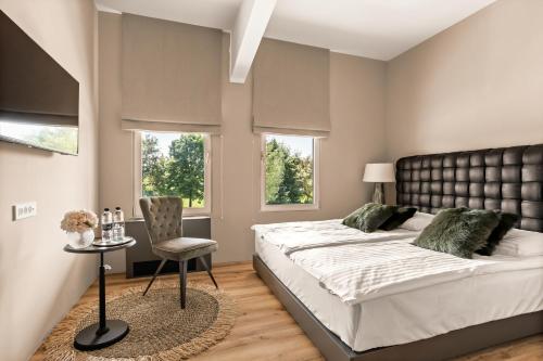Postel nebo postele na pokoji v ubytování Hotel Harmonija SPA & FREE PARKING
