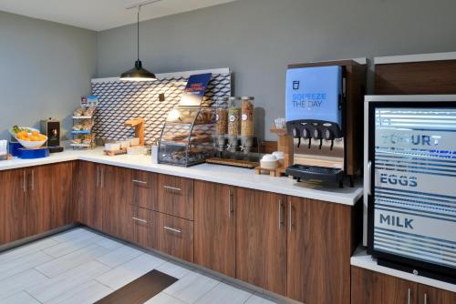 a kitchen with a counter top with at Holiday Inn Express Hotel & Suites Carthage by IHG in Carthage