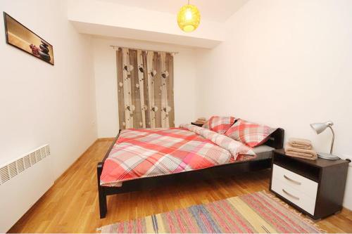 Llit o llits en una habitació de Tim Apartments