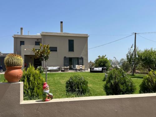 a fire hydrant in front of a house at Olympos Mountain & Sea in Yimnón
