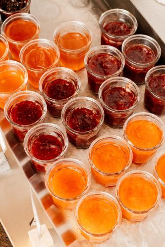 a bunch of jars of food on a table at Hôtel Carcarille Restaurant Le C in Gordes