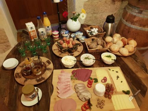 a wooden table with food on top of it at Gohrischer Hof Anno 1798 in Kurort Gohrisch