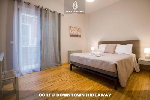 Postel nebo postele na pokoji v ubytování Corfu Downtown Hideaway
