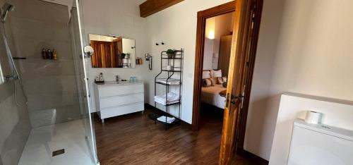a bathroom with a shower and a sink and a toilet at Hospedium Hotel Rural Abadía de Yuste in Cuacos de Yuste