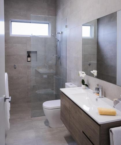 a bathroom with a toilet and a sink and a shower at Port Fairy BNB - The Yellow Suite in Port Fairy