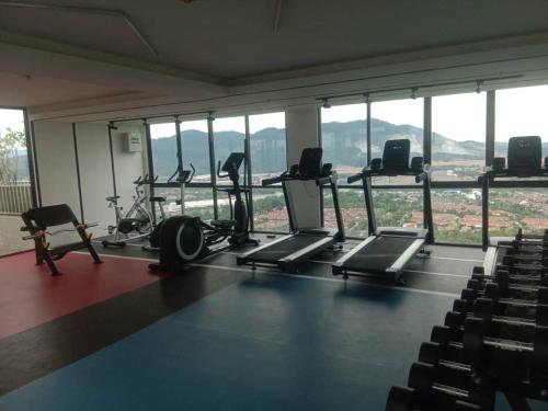 a gym with treadmills and chairs in a building at Youth City Nilai in Nilai