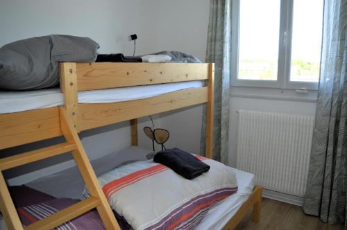 Postel nebo postele na pokoji v ubytování Le Caprice de la mer - maison avec véranda, jardin