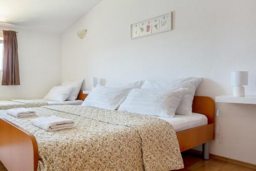Ένα ή περισσότερα κρεβάτια σε δωμάτιο στο Apartments Aurora