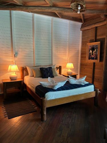 Ένα ή περισσότερα κρεβάτια σε δωμάτιο στο Casa Caribe Hotel