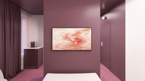 Télévision ou salle de divertissement dans l'établissement Rose - Hôtel Invisible