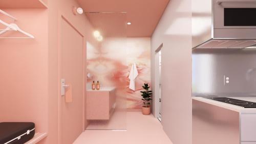 Cuisine ou kitchenette dans l'établissement Rose - Hôtel Invisible