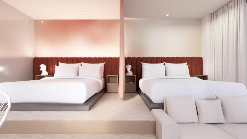 Un ou plusieurs lits dans un hébergement de l'établissement Rose - Hôtel Invisible
