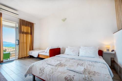 Ένα ή περισσότερα κρεβάτια σε δωμάτιο στο Apartments Aurora