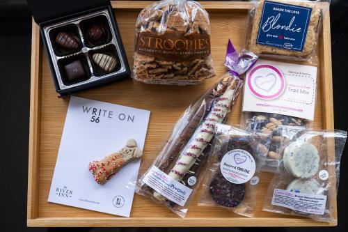 a wooden tray with different types of cookies and pastries at The River Inn in Washington