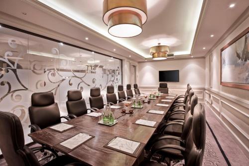a conference room with a long table and chairs at Labourdonnais Waterfront Hotel in Port Louis