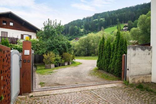 an entrance to a house with a driveway at Friedheim Appartments in Sarntal