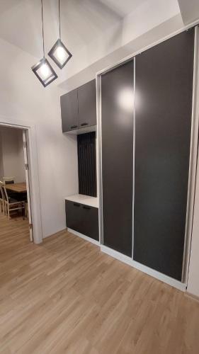 an empty living room with a large glass partition at Petreski Apartments 1 in Ohrid