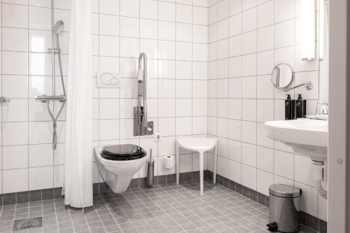 a bathroom with a toilet and a sink at Best Western Plus Park City Malmö in Malmö