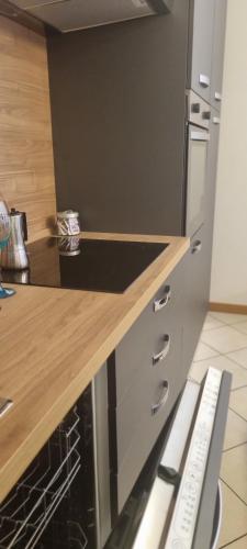 a kitchen with a counter top and a stove top oven at Doge apt near Venice, HFarm, Treviso, Sile River in Quarto dʼAltino